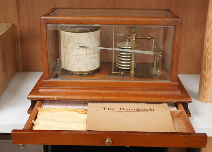 An early 20th century teak cased barograph by Ross, London No.A.529. with drawer underneath containing the original leaflet, spare papers, etc. Condition - fair to good.